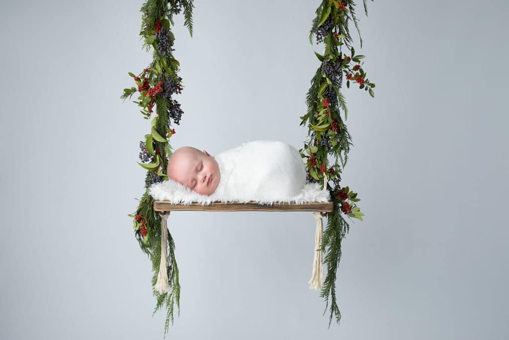 Christmas newborn photography of a newborn baby peacefully sleeping