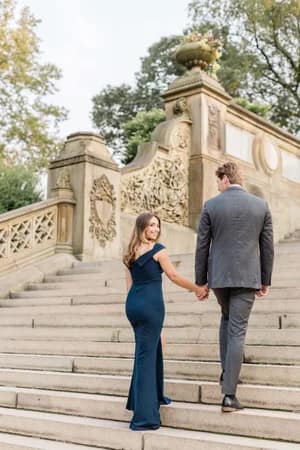 “Engagement photos in Central Park with picnic setup and greenery