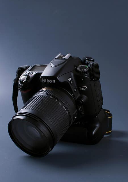 Close-up of a Nikon DSLR camera for photo booth setup, showing professional lens and controls used for event photography in 2026