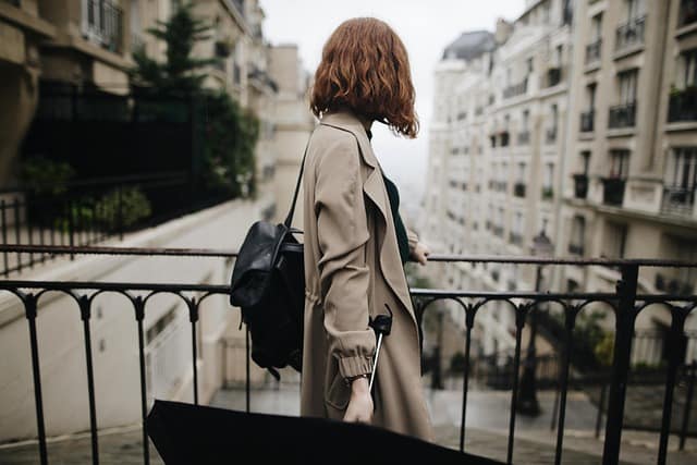 A girl wearing stylish branded clothes posing in a beautiful outdoor location during a lifestyle brand photography session, showcasing confidence and modern fashion.