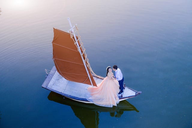 Couple in a boat on the north side during North Georgia waterfall elopement with minister and photography