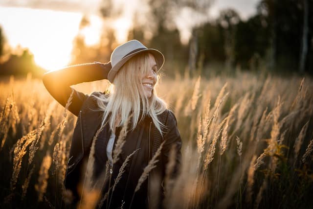 A girl wearing stylish branded clothes posing naturally in soft natural light during a lifestyle brand photography session, showcasing elegance and confidence.