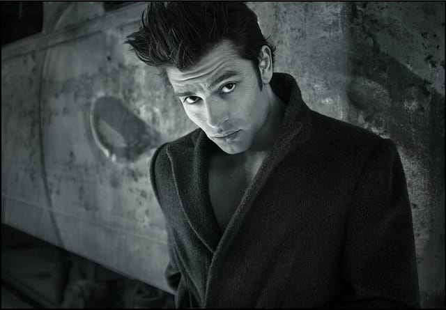 Confident man posing for personal branding photo in professional casual clothing