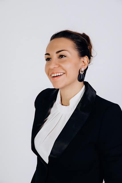  Professional headshot of a woman with a white background

